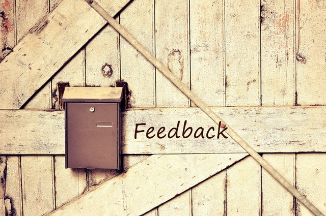 the word feedback written on a barn door