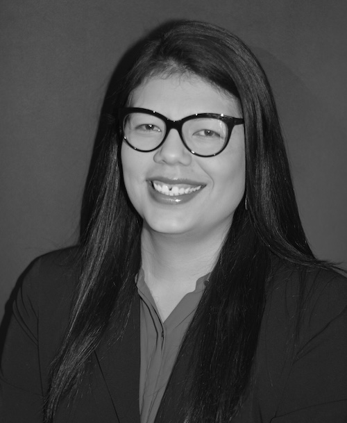 Therapist Georgina Valdez in black and white photo wearing a dark blazer